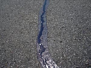 Driveway crack filled with hot pour crack filler